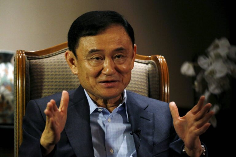 FILE PHOTO: Thailand's ex-PM Thaksin shakes up election with talk of return